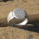 A silver initial ring I found near an old half dollar.