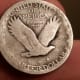 A silver standing liberty quarter I found in my yard metal detecting.