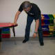 Hinge forward at the hips, and use the non-painful side as support while letting the painful side's arm hang limply.