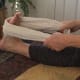 Keep the knee straight to stretch the gastrocnemius muscle. Pull the towel back until you feel a stretch all along your calf.