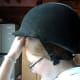 Step nine: Put helmet on over the hairnet back to front.