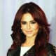 Cheryl Cole sporting a mahogany hair color.