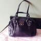 Coach Juliete Mini Satchel Bag. Front view. Although the creed is actually inside this purse, many of these small purses do not have them. Some other ways to verify besides the sales tag would be by the hang tags or any hardware on the purse.