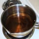 Put an inch or two of water in your larger pot and heat on high.