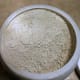 Bentonite clay looks white, but it turns green when mixed in.