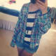 A casual look—flannel top and striped undershirt.