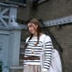 Striped sweater with plaid skirt.