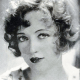 Marion Davies with a chin length curly bob.