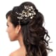 Slightly curly half-up hairstye for a wedding.