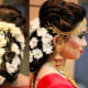 Beautiful low bun with white flowers with a gorgeous front setting.