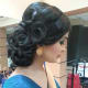 Loose curls and a low-hanging bun.