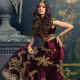 Flowing and voluminous maroon bridal lehenga.