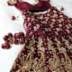 A-cut maroon wedding lehenga with heavy bronze zardozi work.