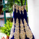 A-cut navy blue wedding lehenga with heavy zardozi work.