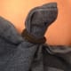 Tying knots on jeans about to be bleached creates interesting patterns on the pants.