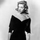 Lauren Bacall wears a pearl choker in the 1940's