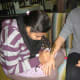 In Jaipur, India, I sit patiently as elaborate henna is drawn onto my arm.