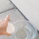 In the meantime, outside in a safe location, carefully pour the lye into the water and stir a few times. Leave it outside to cool for about 10 minutes.