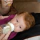 Pull the pacifier and insert the bottle.