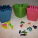 Large and small clothespins sorted by color