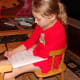 Grace is an eager writer and continues to seek out opportunities to write in her new notebook.