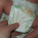 The Huggies diaper has several problems with how it fits. For one, there's too much diaper!
