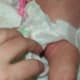 Not only is there a gap, but the waist tabs are coming undone already, and baby isn't even back in her pyjamas!