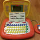 Set up a pretend bank with a toy laptop and pretend checks!