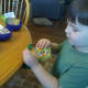 My son deciding on a pack of gummies for a quarter at the candy store.