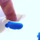 Finger mixing a primary color.