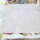 Printer paper is placed over top of the shaving cream and pressed firmly.