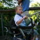 Older kids can hitch a ride on the back of a Sit and Stand Stroller.