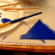 Cut and paint a foam sheet to use as the fin.