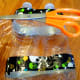 Wrap tape around and cut holes in bottles.