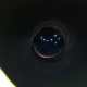Attach the cardstock with holes in the shape of a constellation to a cardboard tube to make a telescope.