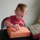 Use stickers, foam letters, and other embellishments to decorate your cardboard city.