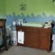 Prepare the baby nursery by adding baby furniture that is practical and helps you stay organized.
