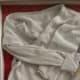 Hospital gown, wrist bands, and comb included in this shadow box detail
