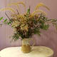 Use dried grasses, weeds, seed pods, rose hips and evergreen shrubbery to make a bouquet.