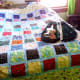 No one could accuse this simple quilt of being a show-stopper. Still, the workmanship is good, and it was made with affection by my husband's mother. (Pardon the messy violin bow which needs restrung, being kept safely in the case.)