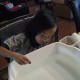 Add pennies to each boat carefully and slowly. Count the number of pennies you add.