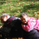 Playing in autumn leaves brings out the little kid in all of us.