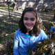 Jumping in the leaves is a fun fall activity for kids of all ages.