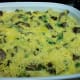 Strata topped with shredded cheese and additional beaten eggs