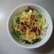 Add shredded cheddar cheese and sprinkle on a few bacon bits.