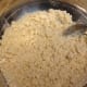 Mix the flour, 1/3 cup powdered sugar, and softened butter until crumbs are small.