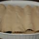 Ladle chipotle sauce over enchiladas