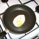 The egg is fried for a couple of minutes on the second side.