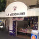 La Michoacana ("the woman from Michoacan"), a popular ice cream shop chain in Mexico. The sign says they also sell elote (corn on the cob) and esquites (corn kernels with mayonnaise, chile and epazote).
