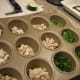 Fill the cupcake pan with chopped veggies